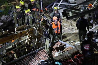 Israeli search and rescue personnel work at the site of a residential building destroyed in an Iranian strike in the northern city of Haifa on April 5, 2026